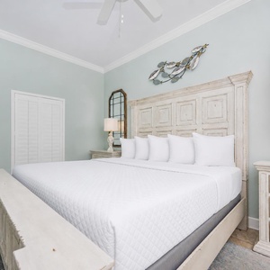 Relax in this serene guest bedroom featuring a king bed, coastal decor, and soft lighting for a restful retreat