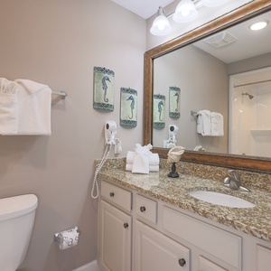 Freshen up in this guest bath in the relaxing shower or soothing tub before an exciting beach day