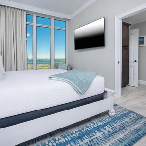 Curl up on the plush king bed, stream shows, and enjoy a colorful sunset from this guest suite