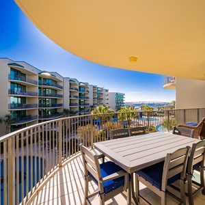 Savor warm breezes on the balcony while unwinding with stunning views of the bay and pool area