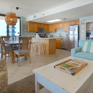 Enjoy the spacious living area with comfortable seating, a dining table, and a view that invites relaxation
