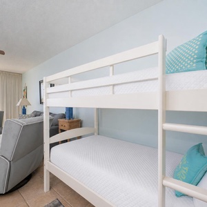 Bunk beds in the living room offer a cozy spot to rest after watching sparkling waves from your balcony
