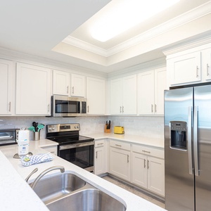 Prepare snacks and meals in this stylish kitchen with stainless appliances and sleek cabinetry