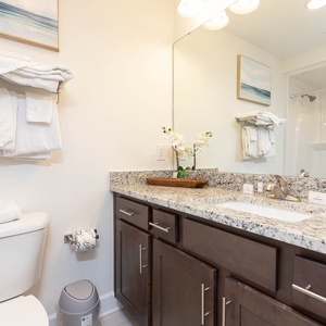 Freshen up before a day of adventure in the guest bath with a refreshing tub-shower combo