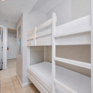 Cozy bunk area in the hallway for kids to enjoy relaxing after a day of adventure