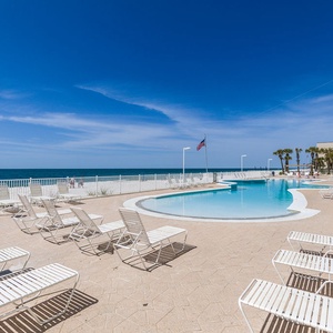 Experience this gradual entry pool with stunning beachfront views and plenty of lounge chairs for a perfect getaway