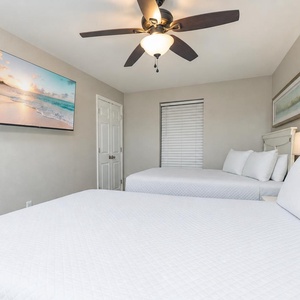 Drift into restful sleep in this queen guest suite while watching your favorite shows