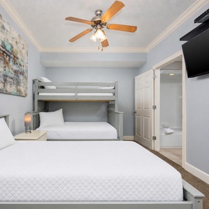 Drift into restful sleep in this cozy guest suite with a twin over full bunk and additional twin bed