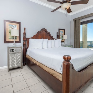 Relax in this inviting master suite featuring a plush king bed and beachfront balcony access