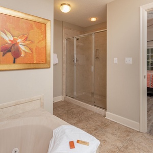 Indulge in relaxation in the master bath with a refreshing walk-in shower and soothing jetted tub