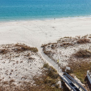 Enjoy stunning beachfront views and access to a relaxing pool area from this inviting outdoor space