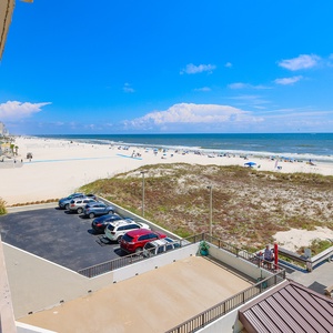 Enjoy stunning beachfront views from this inviting balcony, perfect for relaxation and soaking up the sun