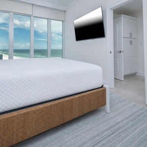 Awaken to a beautiful beach sunrise in this king guest suite surrounded by fluffy pillows