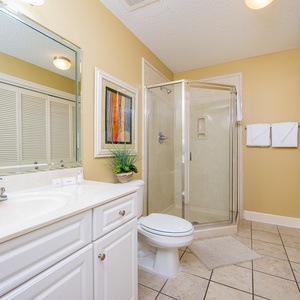 Refresh in this additional guest bath with a walk-in shower and laundry area with a washer and dryer in your rental
