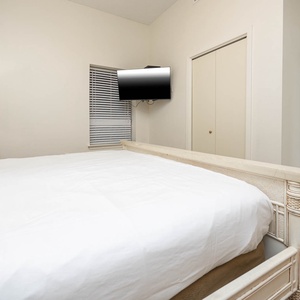 Enjoy restful nights in this inviting bedroom with a king bed and a mounted TV for your entertainment