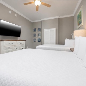 Sink into one of the queens and enjoy a good movie in this welcoming guest room