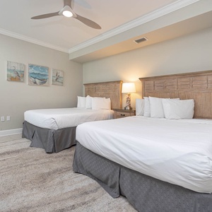 Relax on one of the cozy queen beds in this guest suite and enjoy a peaceful slumber