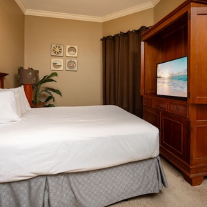 Relax on the cozy queen bed in this guest suite and stream your favorite shows after a beach day