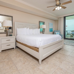 Retreat to this spacious master bedroom with a king bed and direct access to the beachfront balcony
