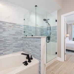 Indulge in relaxation in the master bath soaking tub or sleek walk-in shower, accented by stylish tile and modern fixtures