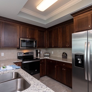 Craft delicious meals and share delightful moments in this inviting kitchen, complete with stainless appliances