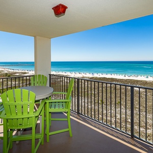 Enjoy sipping your favorite drink at your balcony table while taking in the stunning coastal views