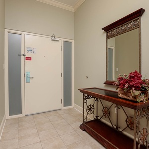 Step into a welcoming entryway, where beautiful decor sets the tone for your relaxing beach getaway