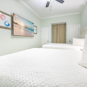 Unwind in this queen guest suite and stream your favorite shows or enjoy a good movie after a beach day
