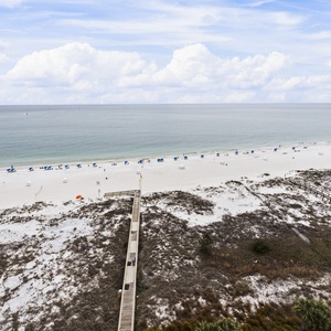 Breathe in the crisp coast air as you gaze at the expansive beach, where adventure and relaxation await