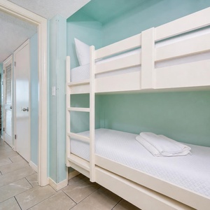 Bunk beds in the sleeping area offer a cozy spot for the kids after fun-filled days along the coast