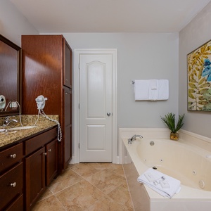 Indulge in a soothing soak in the jetted tub in the master, surrounded by calming decor for the ultimate relaxation