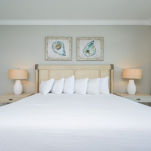 Enjoy peaceful rest in the master bedroom featuring a king bed, soft linens, and stylish decor