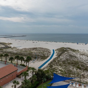 Take in the expansive beach view with lounge chairs and umbrellas, ideal for sunbathing and relaxation