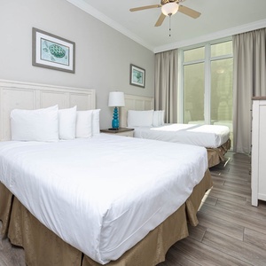 Drift into restful comfort on the queen beds in this guest suite, enjoying a peaceful escape