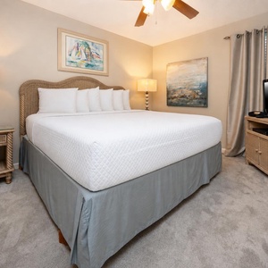 Experience restful nights in this inviting bedroom, featuring a king bed, soft lighting, and tasteful decor