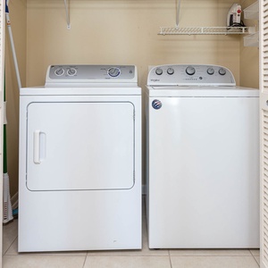 A laundry area features a washer and dryer, providing convenience for guests during their stay