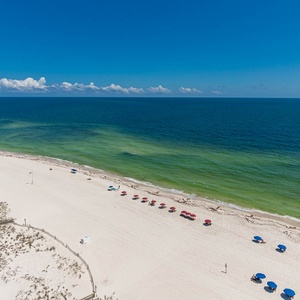 Experience the tranquility of soft sands and gentle waves, perfect for a relaxing day by the shore