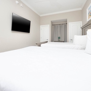 Unwind in this queen guest suite and stream your favorite shows or enjoy a good movie after a beach day