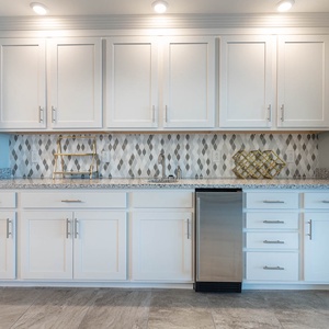 Imagine grabbing a chilled drink from the under-counter fridge at the wet bar and relaxing on the balcony