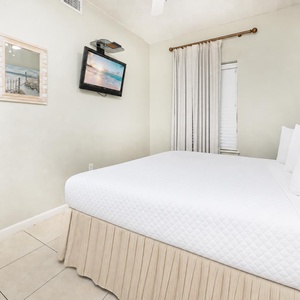 Drift into a peaceful night in this guest suite on the king bed, with a cozy vibe enhanced by charming coastal decor