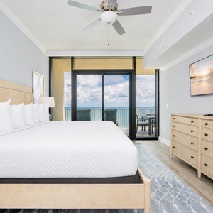 Enjoy restful nights in this king master suite with a king bed, large TV, and stunning beach views