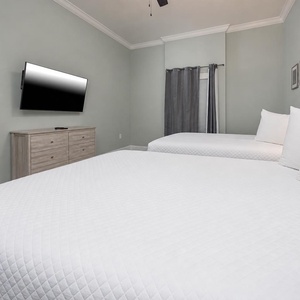 Unwind in this queen guest suite and stream your favorite shows or enjoy a good movie after a beach day