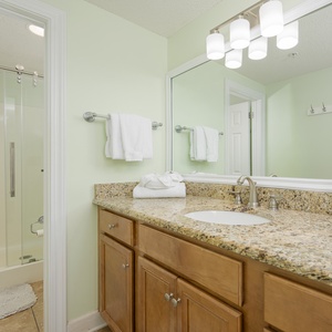 Enjoy the master bathroom featuring a spacious countertop, modern fixtures, and walk-in shower