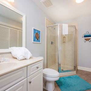 Refresh in this additional guest bath with a walk-in shower and laundry area with a washer and dryer in your rental