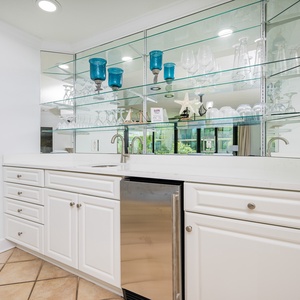 Grab a chilled drink from the fridge or create your favorite cocktail at the wet bar