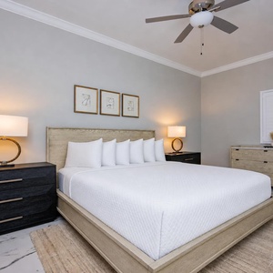 Discover ultimate comfort in the guest bedroom with a king bed, stylish decor, and soft lighting for a restful retreat