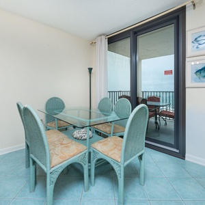 Gather your loved ones around the glass dining table and enjoy lively conversations with beach views as your backdrop