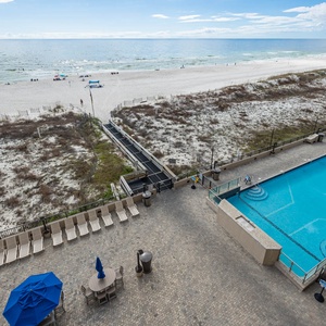 Take a refreshing dip in the inviting pool while enjoying views of the beach and water just steps away