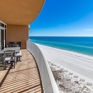 Step onto your private balcony where the Gulf stretches endlessly before you, with dining space to savor morning coffee as waves whisper below.