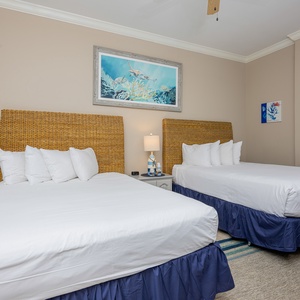 Drift into restful nights on queen beds in this guest room, surrounded by a soothing ambiance and beach decor